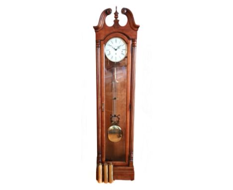 An American mahogany three glass, three weight longcase clock, musical movement, the movement striking on gongs, broken swan 