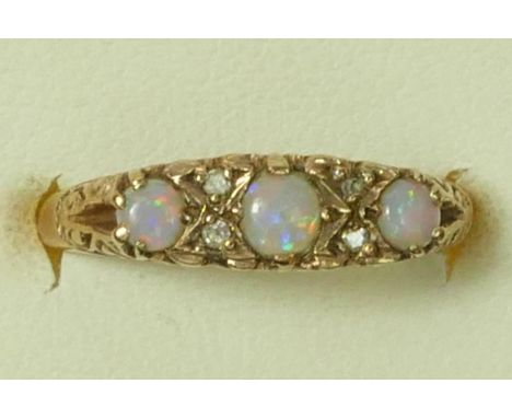 A Victorian style 9ct gold three stone opal ring, diamond points between, M, 2.1gm 