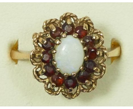 A 9ct gold garnet and opal cluster ring, O, 3.2gm 