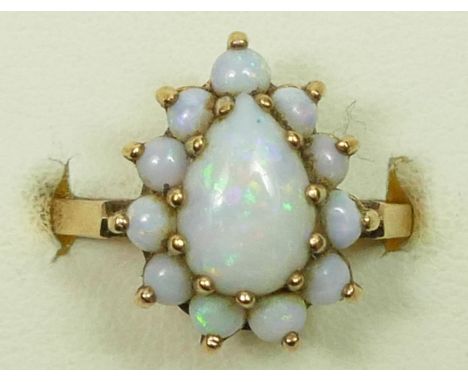 A 9ct gold pear shape opal cluster ring, 15 x 12mm overall, N 1/2, 4gm 