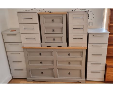 A painted pine chest of three short drawers, 132 x 50 x 184, together with a matching bedside drawer and four other sets of d