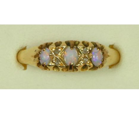 An 18ct gold three stone opal and rose diamond point ring, Birmingham 1918, R 1/2, 3.2gm  One of the claws holding the end st