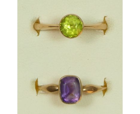 An Edwardian 9ct rose gold and amethyst ring, K 1/2 and an unmarked gold peridot ring, K, 3.9gm 