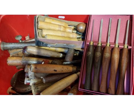 A collection of wood working tools, including planes, hand drills, chisels and others, including brands such as Acord, Record
