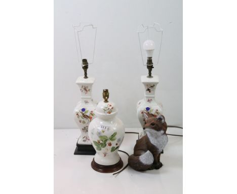 Three ceramic lamp bases with floral and bird decoration together with a outdoor fox ornament. 