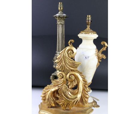 Two table lamp bases in the classical form together with a gilt wall bracket shelf. 