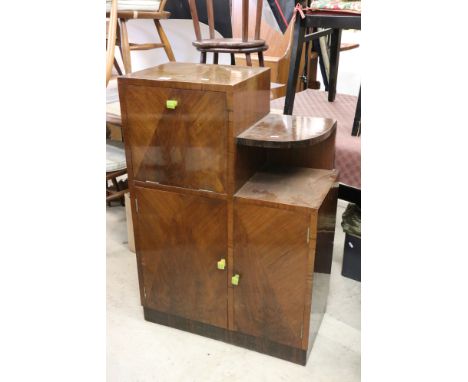 Art Deco Walnut Stepped Cocktail Cabinet with geometric veneer decoration to front of doors and green bakelite handles compri