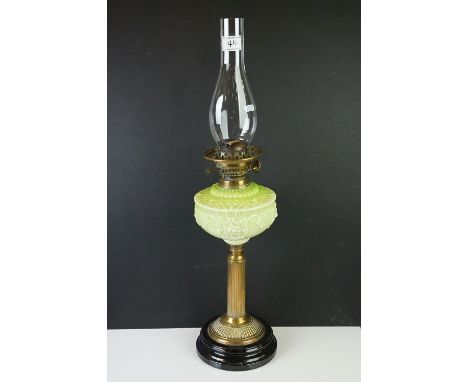 Victorian Oil Lamp with opaque moulded green glass well, brass column support and black socle base, 67cm high 