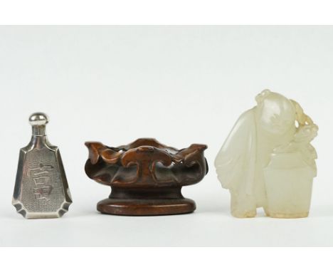 A carved jade figure on wooden base together with a oriental silver scent bottle signed to base. 