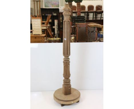 Large Oak Standard Lamp Base, the reeded and foliate carved column raised on a circle base, (lacking fittings) 172cm high 