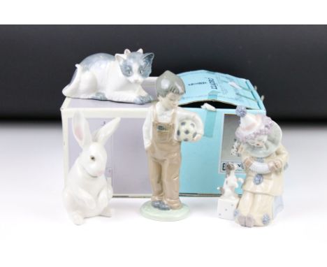 Two Lladro figures, comprising: 5279 'Pierrot with Concertina', 5907 'Sitting Bunny' and two Nao figures 