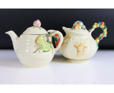 Two Clarice Cliff Newport Pottery Tea Pots, one in the Water Lily pattern with relief mark 30 and the other in the Celtic Har