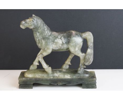 An oriental carved jade figure in the form of a horse. 