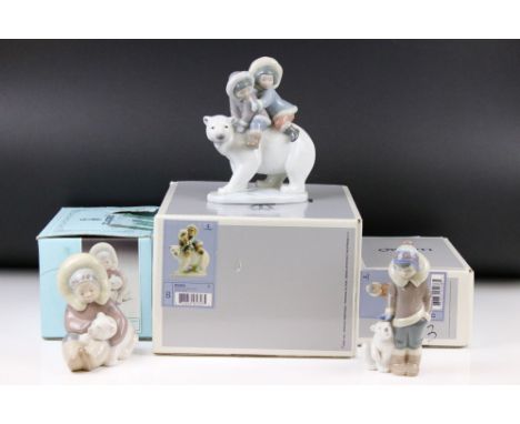 Three Lladro figures, comprising: 1195 'Eskimo Playing, 5238 'Eskimo Boy with Pet' and 5353 'Eskimo Riders', all with boxes 