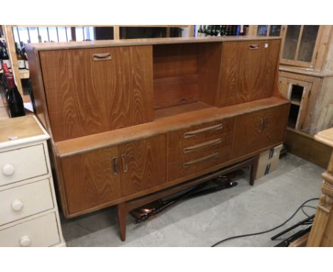 Mid century G-Plan ' Fresco ' Teak Highboard, the upper section comprising a shelf flanked by a cocktail cabinet and a cupboa