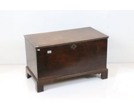 18th century Oak Coffer with hinged lid raised on bracket feet, 81cm wide x 44cm deep x 49cm high 