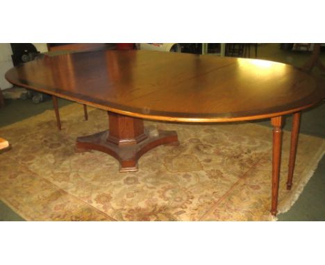 Commissioned bespoke, light oak and mahogany handmade  extending dining table, on single central pedestal base, with pull out