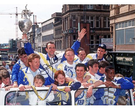 Football Autographed GARY McALLISTER 16 x 12 Photo : Col, depicting a stunning image showing GARY McALLISTER holding aloft th