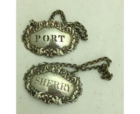 A pair of silver decanter labels for 'Port' and 'Sherry'