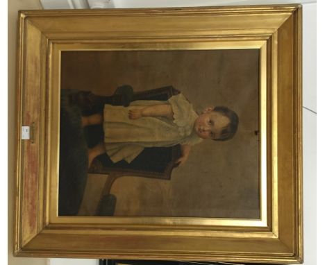 Continental School (19th century):A portrait study of a boy standing on a chair, oil on canvas, in good quality gilt frame 