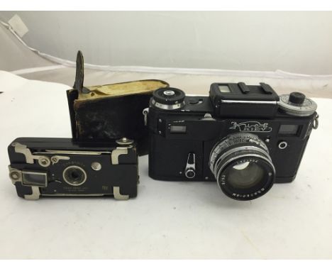 A vintage Kiev camera and a boxed Ensignette