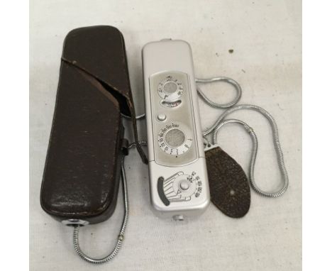 A cased Minox spy camera
