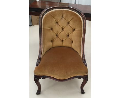 A Victorian button back easy chair