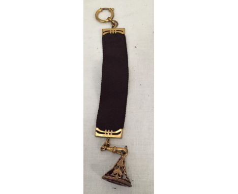 A Victorian sash suspended carnelian carved fob of a gentleman