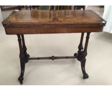 A Victorian walnut card table