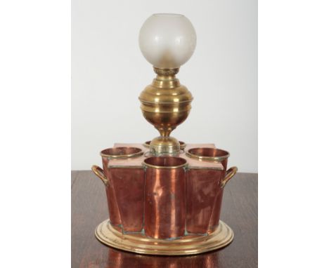 AN EARLY 20TH CENTURY FRENCH COPPER AND BRASS WINE COOLER BY SAUDARD of Art Deco design, the angled body with four divisions,