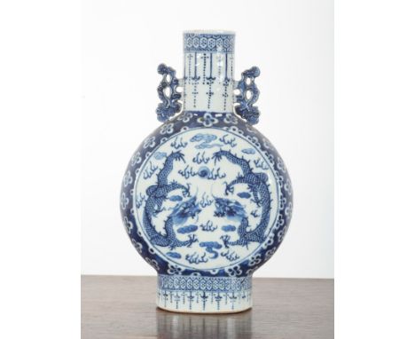 A CHINESE BLUE AND WHITE PORCELAIN MOON FLASK 19th Century, with moulded leaf scroll handles, painted to each side with drago