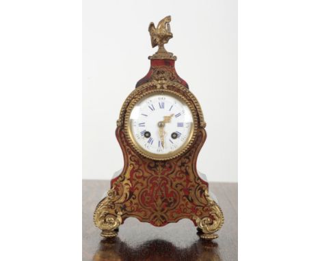 A 19TH CENTURY BOULLE MANTEL CLOCK BY R. FAGE OF PARIS the shaped case with cockerel finial, ormolu mounts and porcelain dial