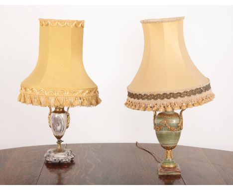 AN ORMOLU MOUNTED ONYX ELECTRIC TABLE LAMP of Louis XVI style, of baluster shape, with scrolled handles and floral swags, on 