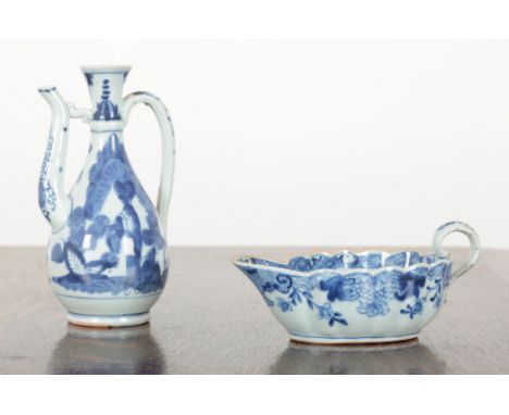 A CHINESE BLUE AND WHITE EXPORT PORCELAIN ‘SILVER SHAPE’ SAUCEBOAT 18th Century, the interior decorated with mother and child