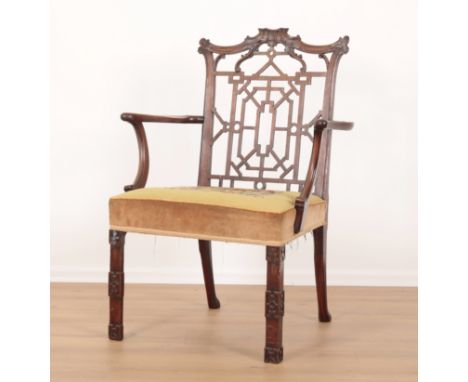 A 'CHINESE CHIPPENDALE' STYLE MAHOGANY ARMCHAIR the square seat with yellow tapestry seat, on blind fret carved block front l