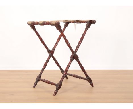 A VICTORIAN MAHOGANY BUTLER'S TRAY STAND with ring turned legs and stretchers, on turned taped feet, 74cm high x 57cm wide x 