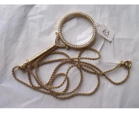 Gilt pearl mounted quizzing glass on chain 10cm long  