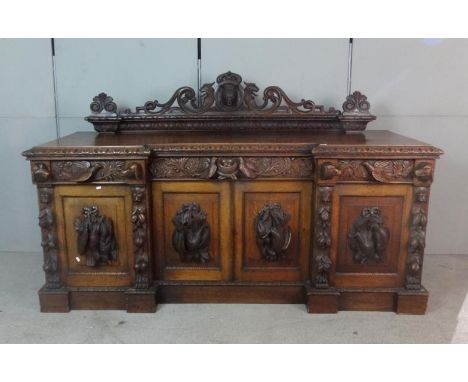 Mid Victorian Gothic Revival Golden Oak Break Front Sideboard, 4 doors each with game birds, stiles with leaves & fruits surm