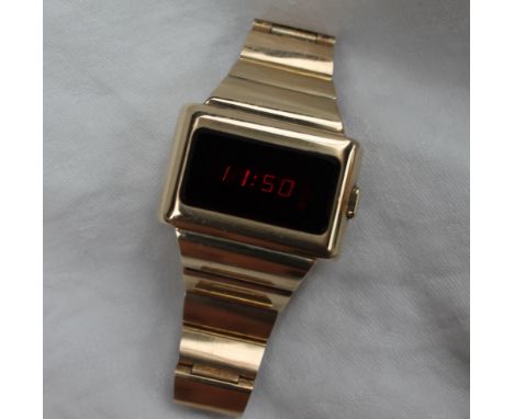 A Gentleman's yellow metal Omega Time Computer LED wristwatch, the red rectangular dial with push button operation on an inte