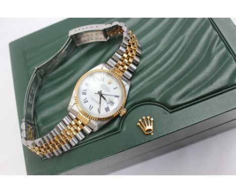 A Rolex Oyster perpetual datejust superlative chronometer, with a two tone bracelet strap, the white dial with Roman numerals