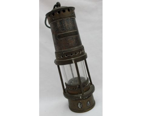 A T. Thomas steel and brass miners lamp, with a domed top, bears a plaque to the body, D W Morgan, the wick stamped 15 F Harr