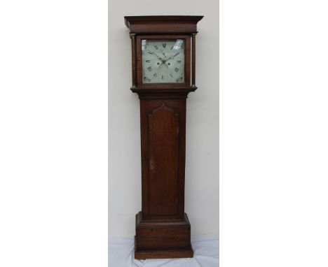 An 18th century oak cased longcase clock, the moulded cornice above Ionic columns and a long trunk door, box base and plinth,