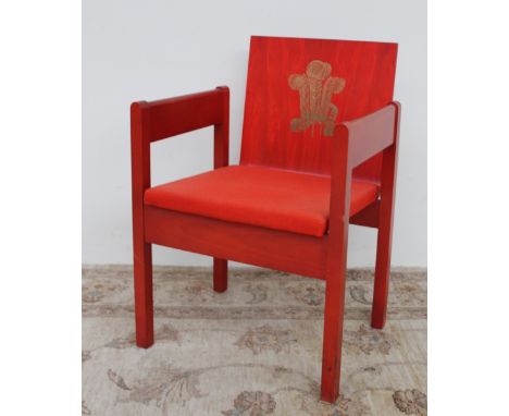 The Earl of Snowden and Carl Toms, a red painted beech and laminate elbow chair produced for the Investiture of the Prince of