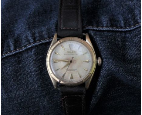 A Gentleman's Rolex Oyster-perpetual officially certified chronometer with a cream coloured dial and batons, model No. 6085, 
