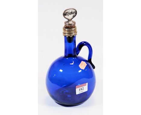 A late 19th century Bristol blue glass decanter, of mallet form, having loop handle and white metal mount, the associated whi