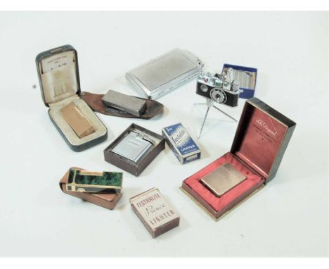 A novelty Photo Flash table lighter, in the form of a camera, in original box, together with various pocket cigarette lighter