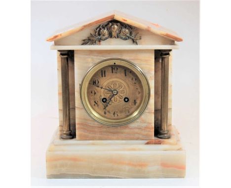 An early 20th century onyx cased architectural mantel clock having unsigned brass dial, and French brass eight day cylinder m