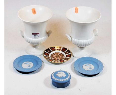 A pair of Wedgwood cream glazed campagna shaped urns; together with two Wedgwood blue jasper ware dishes, a Wedgwood jasper w