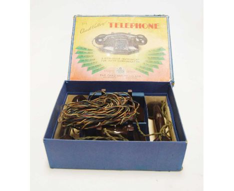 A Chad Valley 1950s bakelite two-piece telephone gift set, housed in the original labelled blue ground box