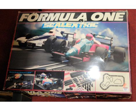 A Scalextric boxed Formula 1 race-car gift set (missing one car otherwise appears near-complete)